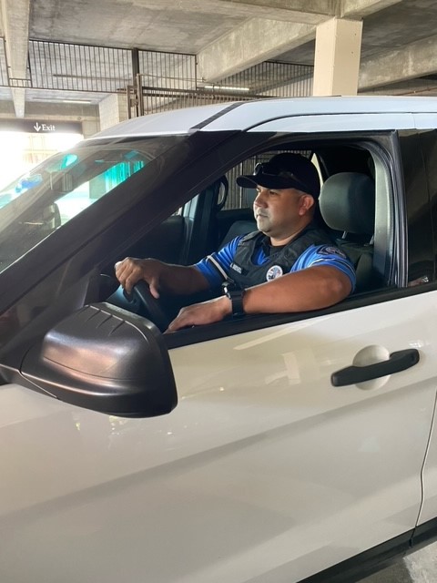 Multi Housing District Patrol officer in a patrol vehicle responding to an alarm call
